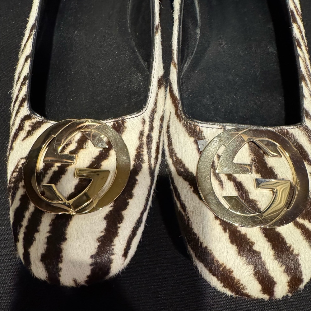 Gucci Black and White Zebra Flats with Gold Logo